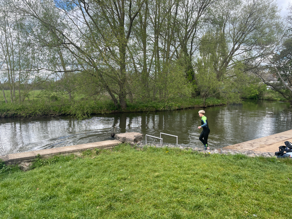 The bathing spot in French Weir park with a person in a wetsuit getting into the river